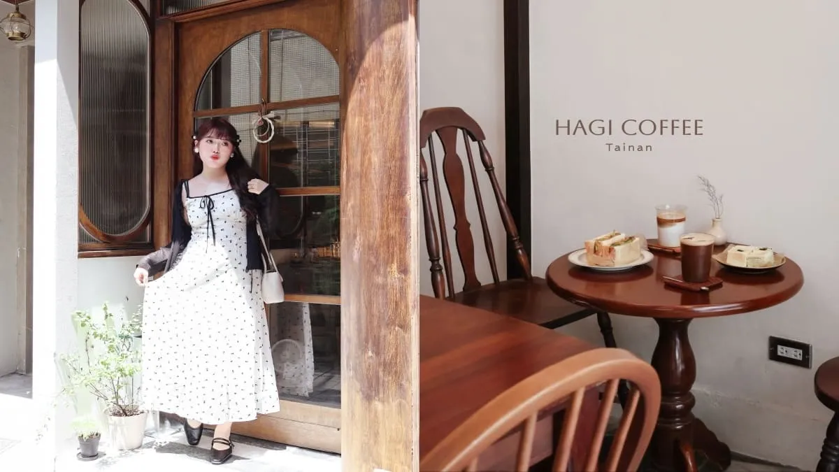 A woman in a white polka-dot dress and black cardigan stands at a wooden cafe door, posing outside HAGI COFFEE in Tainan.